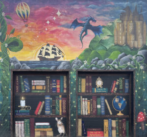 A Magical scene with bookshelves, full of classic books. A bean stalk, dragon, hot air balloon, castle, and pirate ship are painted around it. Art by Allison Pence.