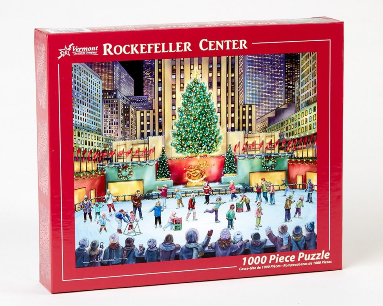 Rockefeller Center in New York with a lit Christmas tree and skaters.